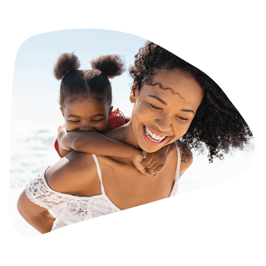 african american mother and child piggybacking laughing