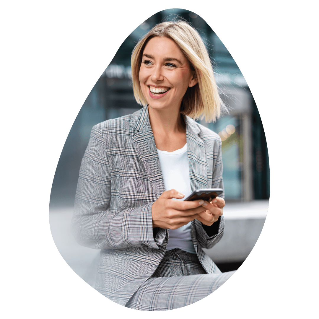 Blond woman smiling with cell phone on hands