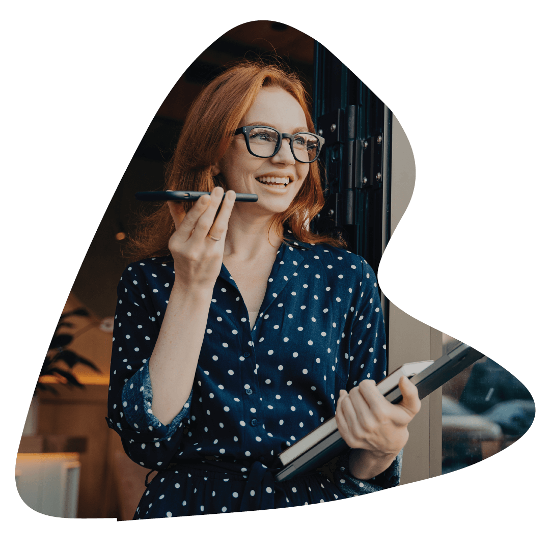 Red head woman smiling talking a phone